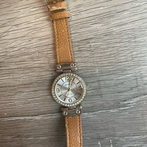 Women’s watch brown band white face